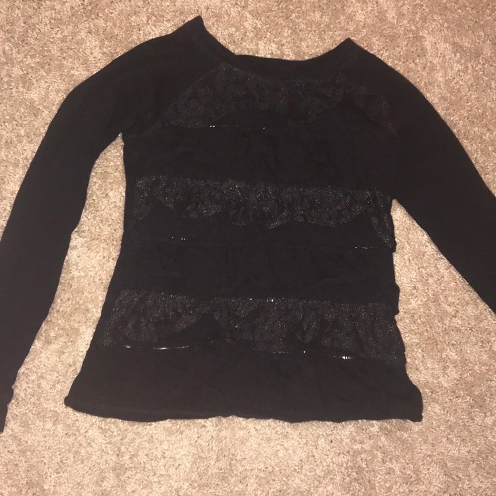 Black long sleeve tee shirt with ruffles on front
